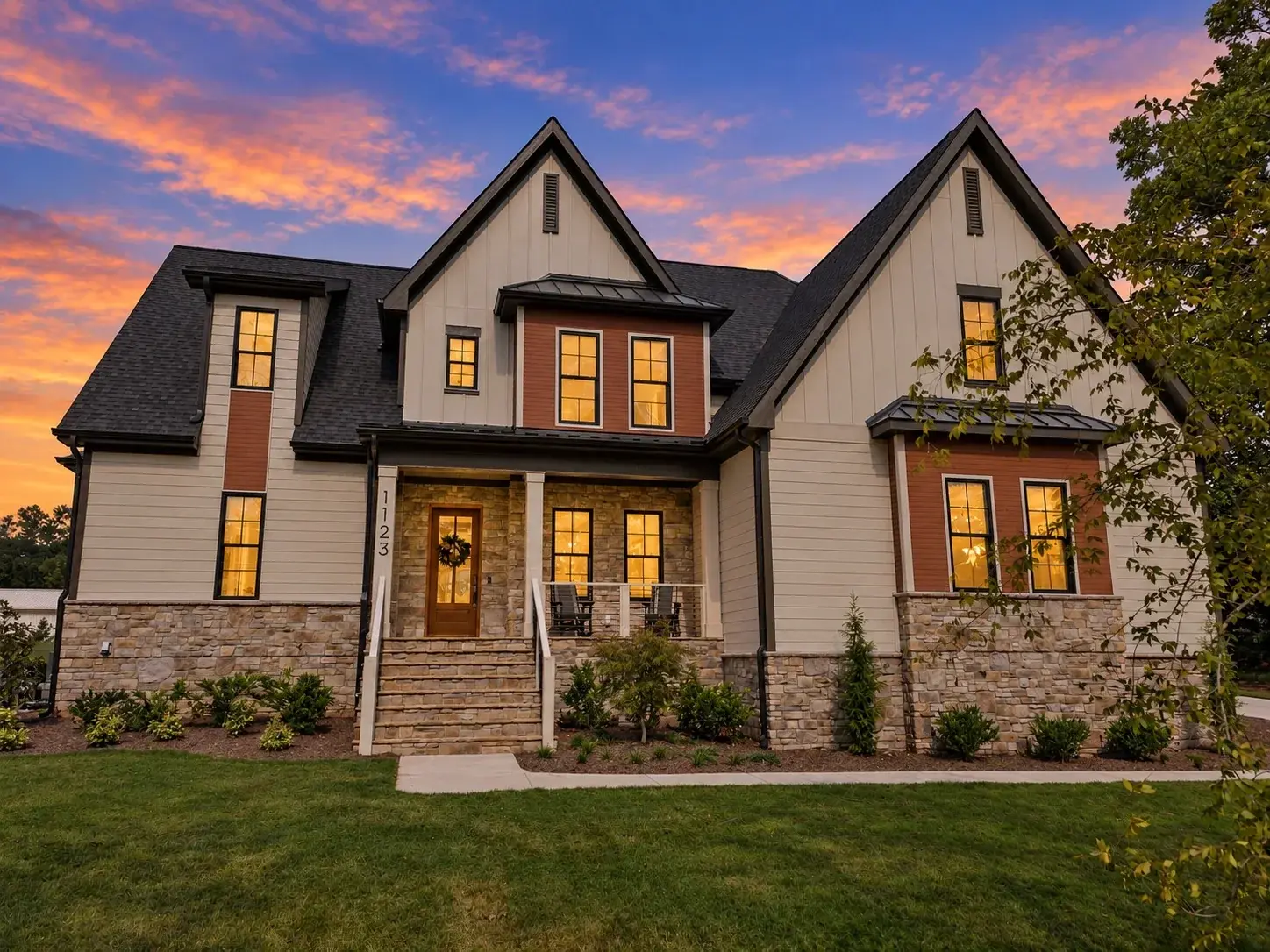 Front elevation of 1123 Dovefield Lane at dusk, a move-in ready Russin Homes build in Silverleaf